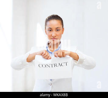 business and office, legal concept - african businesswoman tearing contract Stock Photo