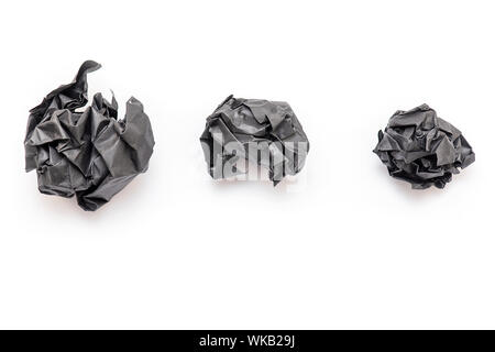 Real Black Paper crumpled as Ball, wrinkled paper texture, isolated on white Background Stock Photo