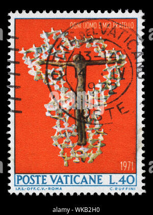 Stamp issued in Vatican shows Crucifix and doves, Against racial discrimination, circa 1971. Stock Photo