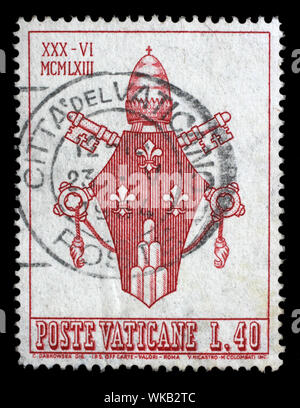 Stamp issued in Vatican shows Coat of Arms of Pope Paulus VI, circa 1963. Stock Photo