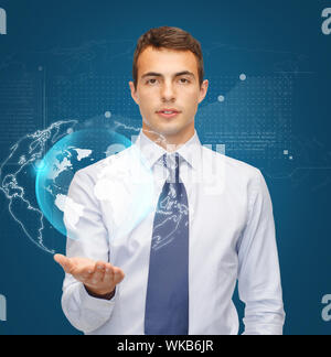 business, office and new technology concept - friendly young buisnessman holding virtual sphere globe on the palm of his hand Stock Photo