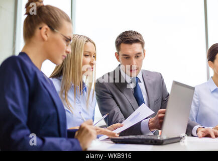 business team with laptop having discussion Stock Photo