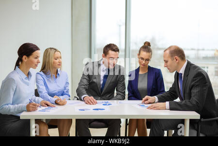 business team with documents having discussion Stock Photo