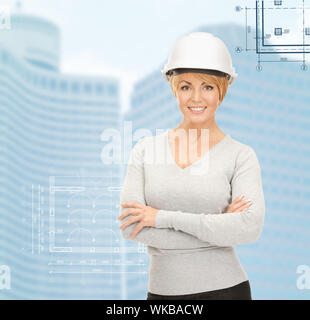building, developing, consrtuction, architecture concept - female contractor in white helmet Stock Photo