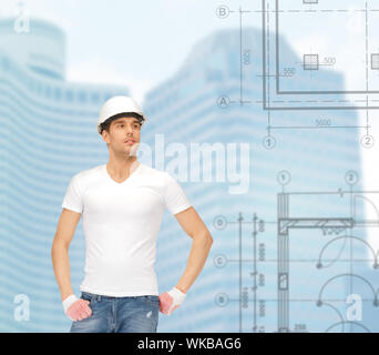 building, developing, consrtuction, architecture concept - handsome builder in white helmet Stock Photo