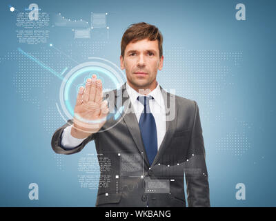 business, future technology and office concept - attractive buisnessman working with virtual screen Stock Photo
