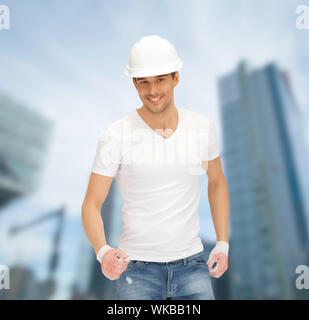 building, developing, consrtuction, architecture concept - handsome builder in white helmet Stock Photo