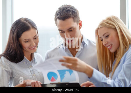 business team looking at clipboard Stock Photo