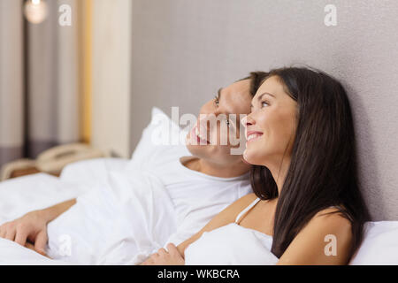 happy couple dreaming in bed Stock Photo