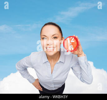 smiling businesswoman with red clock Stock Photo