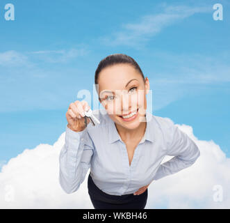smiling businesswoman with house keys Stock Photo