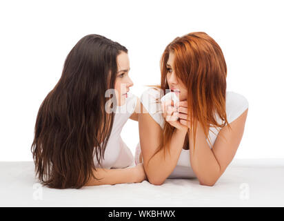 friendship and happy people concept - one teenage girl comforting another after break up Stock Photo