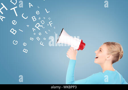 communication concept - woman with megaphone over blue background Stock Photo