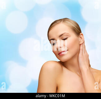health and beauty concept - face and hands of beautiful woman Stock Photo