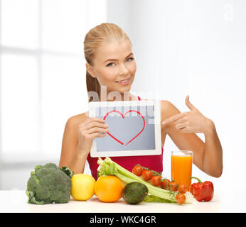 woman with fruits, vegetables and tablet pc Stock Photo