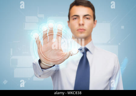 attractive buisnessman working with virtual screen Stock Photo