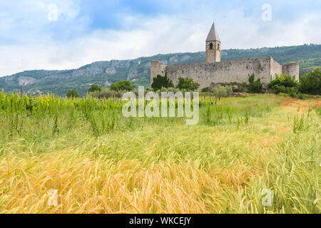 Church of the Holy Trinity, which contains famos late-medieval Danse Macabre fresco. Slovenia, Europe. Stock Photo