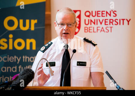 PSNI chief constable Simon Byrne speaks at the Patten 20 Years On: Young People, Policing and Stop and Search conference, in the Great Hall of Queen's University Belfast. Stock Photo