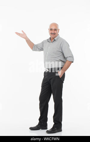 Businessman showing empty palm Stock Photo