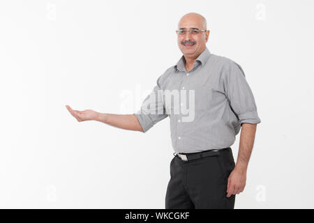 Businessman showing empty palm Stock Photo