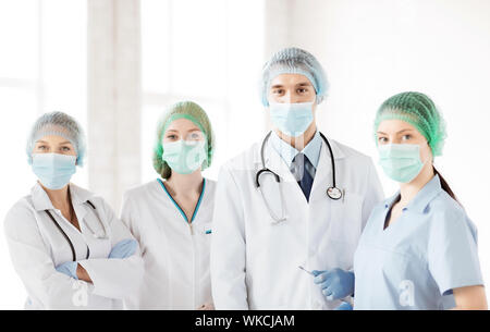 group of doctors in operating room Stock Photo