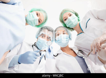 group of doctors in operating room Stock Photo