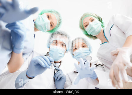 group of doctors in operating room Stock Photo