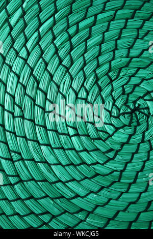 Vertical image of woven water hyacinth place mat abstract pattern in mint green color Stock Photo
