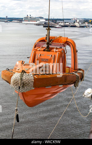 Ribbed fast rescue craft on Queen Mary 2 qm2 sitting on davits. Stock Photo