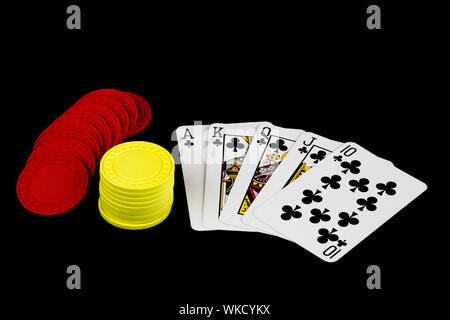 A winning poker hand with chips on black background Stock Photo