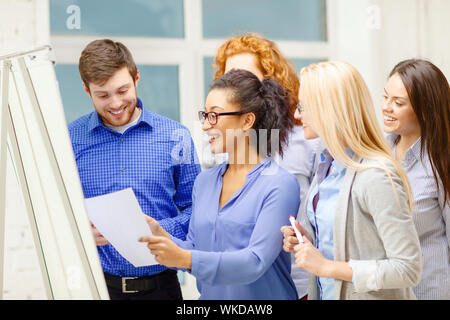 smiling business team having discussion in office Stock Photo