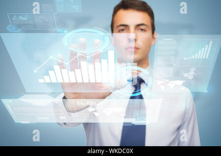 attractive buisnessman working with virtual screen Stock Photo