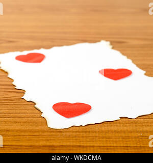 white paper and red heart on wooden background concept for valentine day Stock Photo