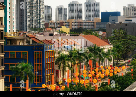 Chinatown, Singapore - February 8, 2019: Aerial view of Chinatown with red roofs and Central Business District Stock Photo