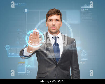 attractive buisnessman wotking with virtual screen Stock Photo
