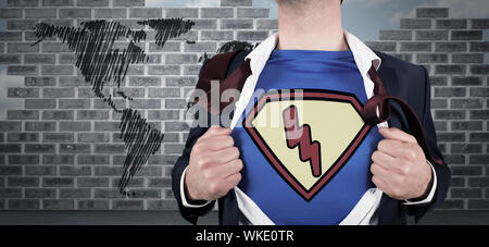 Businessman opening shirt in superhero style against world map doodle against wall Stock Photo