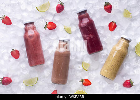 Refreshing detox smoothie drinks with fresh strawberries on ice Stock Photo