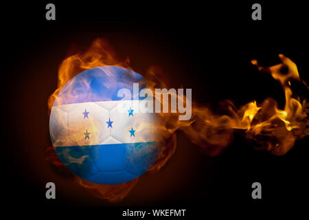 Composite image of fire surrounding honduras ball against black Stock Photo