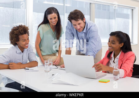 Team of architects going over blueprints in the office Stock Photo