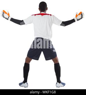 Goalkeeper in white ready to save on white background Stock Photo