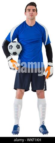 Handsome goalkeeper in blue jersey on white background Stock Photo