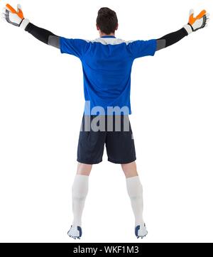 Goalkeeper in blue ready to save on white background Stock Photo