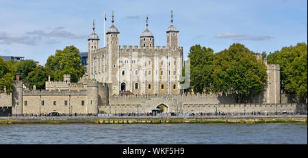 Panoramic view of iconic historical White Tower within Tower of London Royal Palace fortress & major tourism attraction beside River Thames England UK Stock Photo