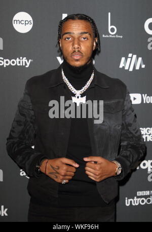 Rapper AJ Tracey on the red carpet arrivals board during the AIM Independent Music Awards 2019 held at the Roundhouse in London. Stock Photo