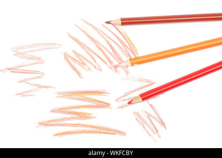 Group of three whole colored pencil with several scratches flatlay isolated on white background Stock Photo