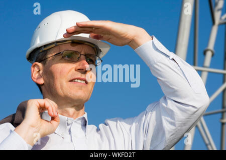 Engineer searching in front of steel construction Stock Photo