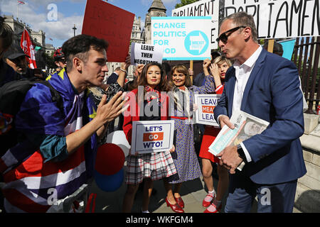 Alice and Beatrice Grant Brexit Party supporters with banners at