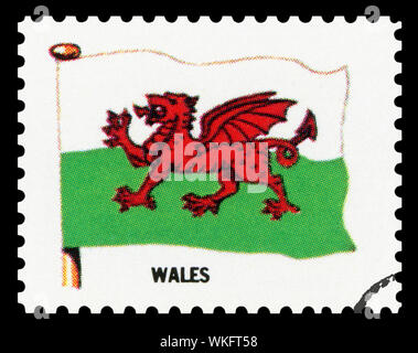 WALES FLAG - Postage Stamp isolated on black background. Stock Photo