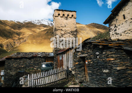 Old ramshackle traditional Svan Towers and machub house with flagstone in Ushguli commune, Upper Svaneti, Georgia. Georgian landmark Stock Photo