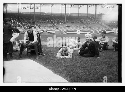 Joe Welling, boxer amid Cleveland baseball players in stadium, 1918 Stock Photo